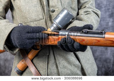 A Ww Ii German Soldier With Rifle And Ammunition