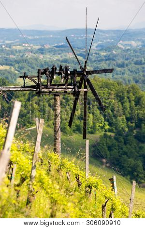 vineyard with windmill called klapotetz in south of Styria, Austria