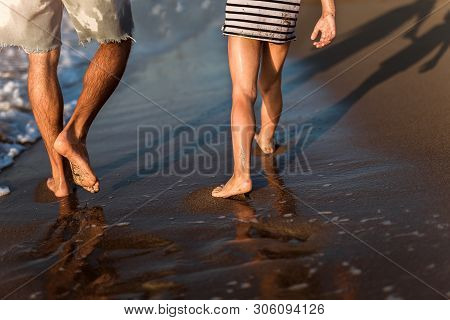 Father And Son, Man & Boy Child, Running And Having Fun In The Sand And Waves Of A Sunny Beach