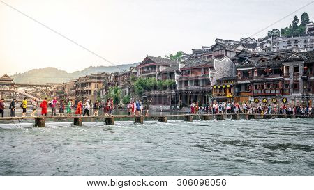 2 June 2019, Fenghuang China : Chinese Tourists On Bridge Over Tuo Jiang River And Old Fortification