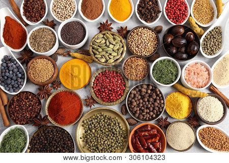 Aromatic Spices And Herbs In Metal And Ceramic Bowls. Top View.