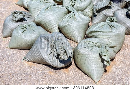 Sandbags For Flood Defense Or Military Use On The City Road