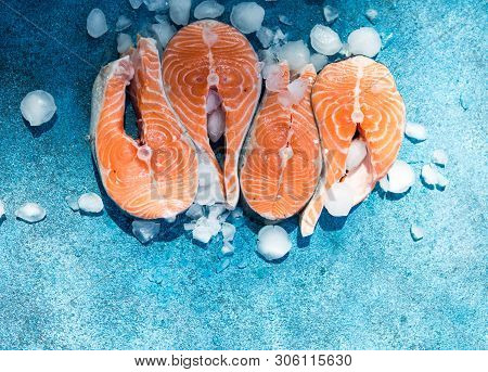Clipping Path Fresh Salmon Steak On Concrete Blue Background With Basil And Iced. Salmon Red Fish St