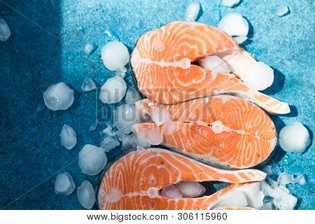Clipping Path Fresh Salmon Steak On Concrete Blue Background With Basil And Iced. Salmon Red Fish St