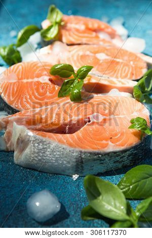 Clipping Path Fresh Salmon Steak On Concrete Blue Background With Basil And Iced. Salmon Red Fish St