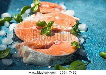 Clipping Path Fresh Salmon Steak On Concrete Blue Background With Basil And Iced. Salmon Red Fish St