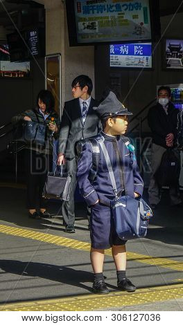 Osaka, Japan - Apr 12, 2019. Unidentified Little Japanese Student Wait For A Train To School In The 