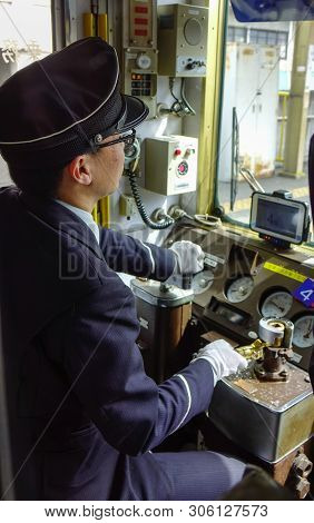 Driver Working In The Cockpit Of Train