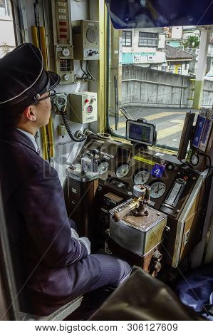 Driver Working In The Cockpit Of Train
