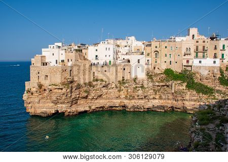 Panoramic City Skyline With White Houses Of Polignano A Mare, Town On The Rocks, Puglia Region, Ital