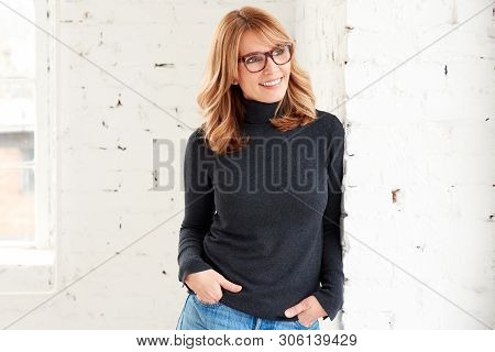 Smiling Casual Woman Looking Out The Window