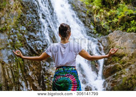Asian Women Relax In The Holiday. Play If Yoga.  Play If Yoga At Waterfall On The Moutain. Exercise,