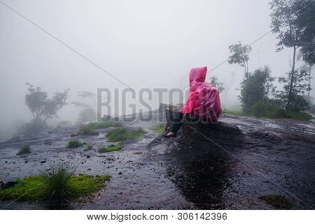 Tourist With Pink Rain Coat Stand View The Scenery Natural Beautiful Touch Fog At Phu Hin Rong Kla N