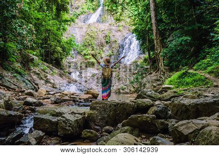 Asian Women Relax In The Holiday. Travel Waterfall On The Moutain (huai Toh Waterfall) At Krabi. Tra
