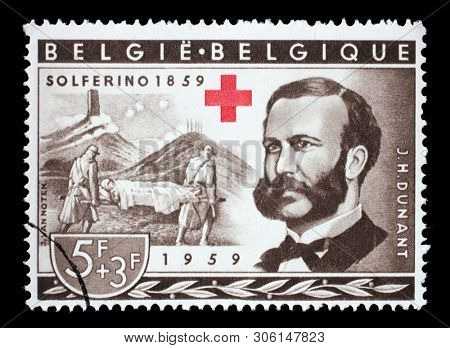 ZAGREB, CROATIA - JULY 03, 2014: A stamp printed in Belgium shows Henri Dunant, Founder of the Red Cross and Battle of Solferino, Red Cross series, circa 1959.