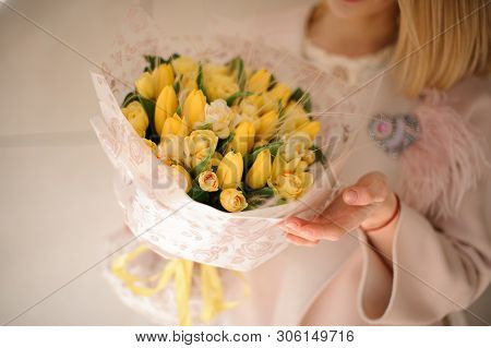 Bunch Of Yellow Tulips In Girls Hands