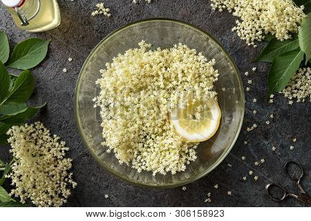 Macerating Elder Flowers And Lemon In Water, To Prepare Homemade Herbal Syrup. Top View