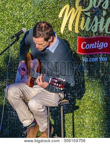 Man Playing Guitar At Street Fair Event, Montevideo, Uruguay