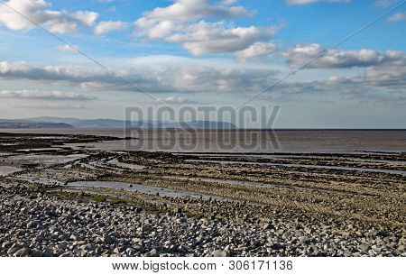 East Quantoxhead Beach In Somerset. The Limestone Pavements Date To The Jurassic Era And Are A Parad