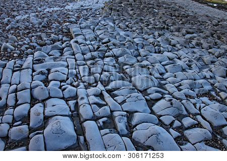 East Quantoxhead Beach In Somerset. The Limestone Pavements Date To The Jurassic Era And Are A Parad