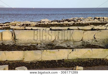 East Quantoxhead Beach In Somerset. The Limestone Pavements Date To The Jurassic Era And Are A Parad