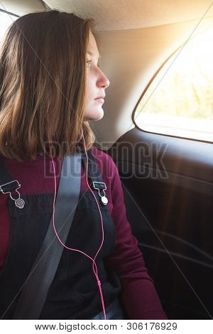 Girl Teenager In A Car Wearing A Seat Belt