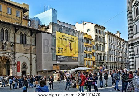People Relax In The Old Town. Tourists Walk Along San Giovanni Square, Duomo District In Florence. I