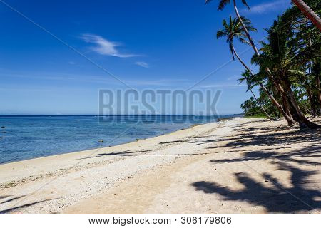 Beach On The Tropical Island Clear Blue Water. Dravuni Island, Fiji.