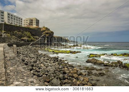 Coast Line Of Bajamar. Surf And Big Round Stones. Canary Island, Tenerife, Spain