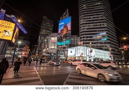 Toronto, Ontario - November 13, 2018: Skyscrapers On Yonge Dundas Square, With People Crossing On A 