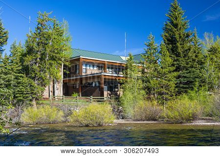 Silverthorne, Colorado Town Hall On A Sunny Day With The Blue River