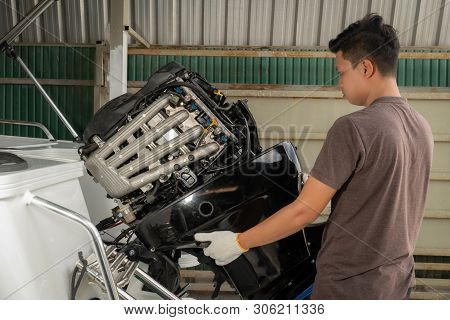 Repairing Engines On Aluminum Boats , The Technician Is Removing The Boat Parts To Make The Paint