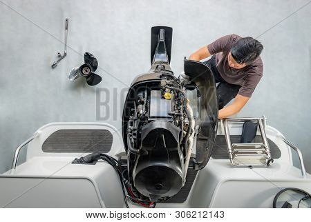 Repairing Engines On Aluminum Boats , The Technician Is Removing The Boat Parts To Make The Paint