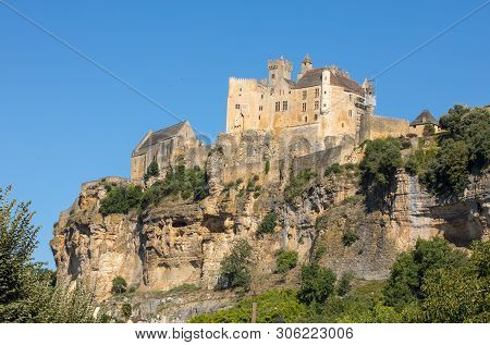 The Medieval Chateau De Beynac Rising On A Limestone Cliff Above The Dordogne River. France, Dordogn