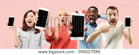 Portrait Of People Showing Mobile Phones Isolated Over Coral Background. Male And Female Models Usin