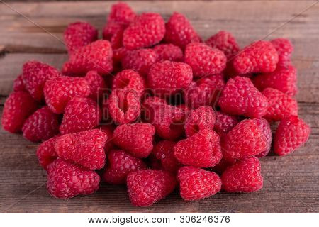 Sweet Fresh Organic Raspberries Background Close-up. Fresh And Sweet Raspberries Background