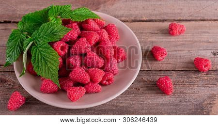Sweet Fresh Organic Raspberries Background Close-up. Fresh And Sweet Raspberries Background