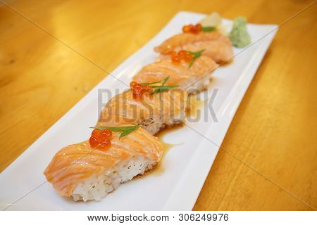 Grilled Salmon Sushi - Set Of Salmon Aburi Sushi Topped With Sweet Sauce And Salmon Roe (ikura), Tra