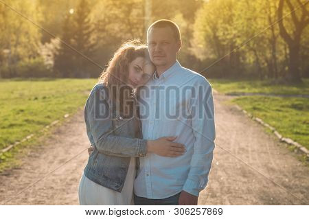 A Young Couple Spends Time Together Outdoors. Couple Having Fun Summer Time.