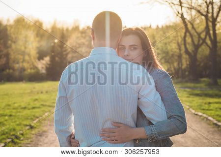 A Young Couple Spends Time Together Outdoors. Couple Having Fun Summer Time.