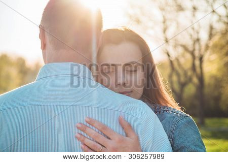 A Young Couple Spends Time Together Outdoors. Couple Having Fun Summer Time.