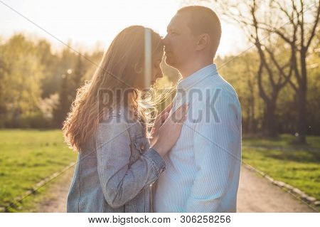 A Young Couple Spends Time Together Outdoors. Couple Having Fun Summer Time.