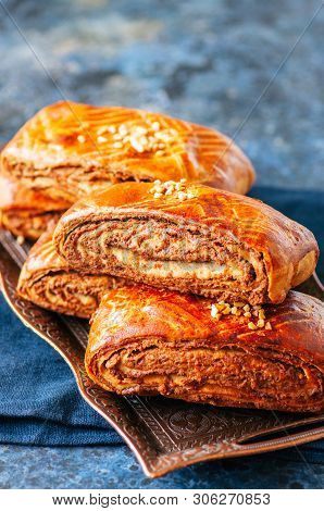 Traditional Turkish Pastry Roll With Chocolate And Nuts Filling - Pastich Served On A Vintage Tray.