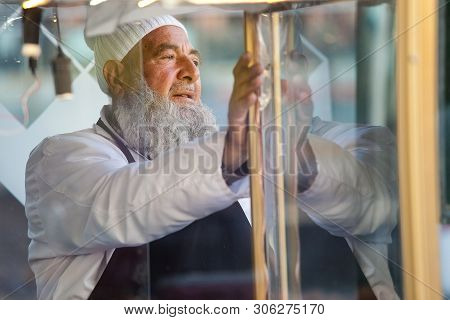Istanbul, Turkey, - September 10, 2014: Portrait Of The Seller Of The Semites. Close Up. Blurred Bac