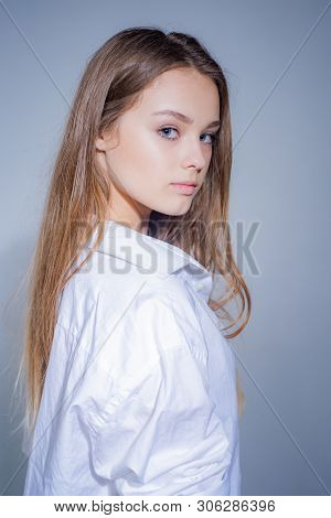 Headshot Portrait Of Beauty Girl With Beauty Face Looking At Camera. Close Up Portrait Of Young Chee