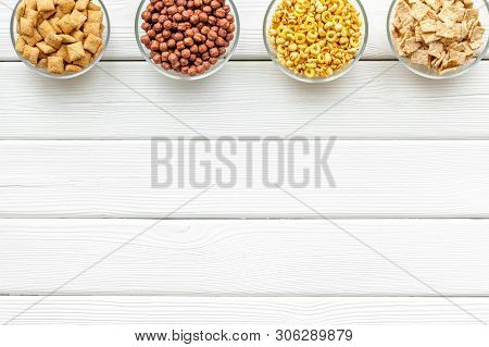 Cereals, Oatflakes And Cornflakes For Healthy Breakfast On White Wooden Background Top View Mock Up