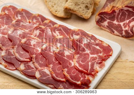 Sliced Loin On Ceramic Cutting Board