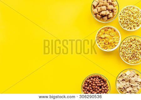 Cereals, Oatflakes And Cornflakes For Healthy Breakfast On Yellow Background Top View Mock Up