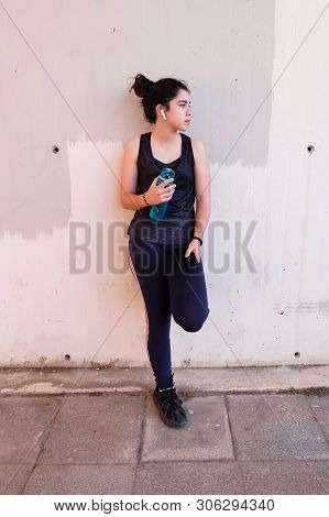 Tview Of Teenager Taking A Break After Training