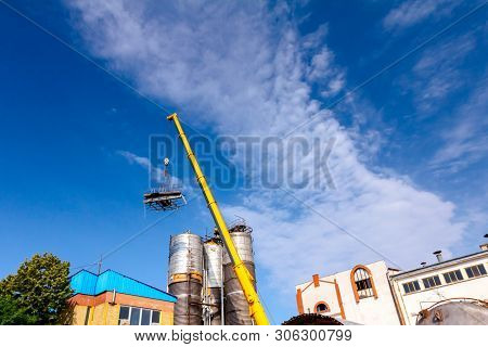 Crane Is Bringing Down Part Of Heavy Metal Construction In Industrial Complex.